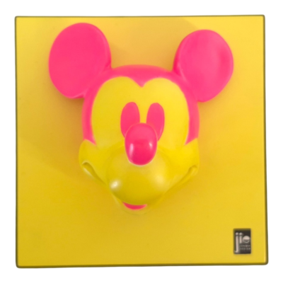 Close-up of a pink Mickey Mouse head silhouette on a yellow background, as on product packaging.